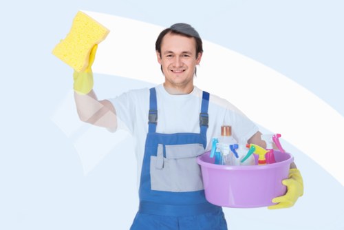 Cleaner preparing a renovated room after building work in SW15