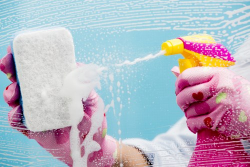 Professional carpet cleaners working with careful safety procedures