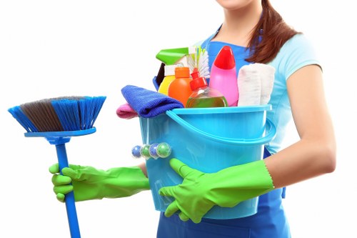 Professional cleaner maintaining shared stairs and entrance areas